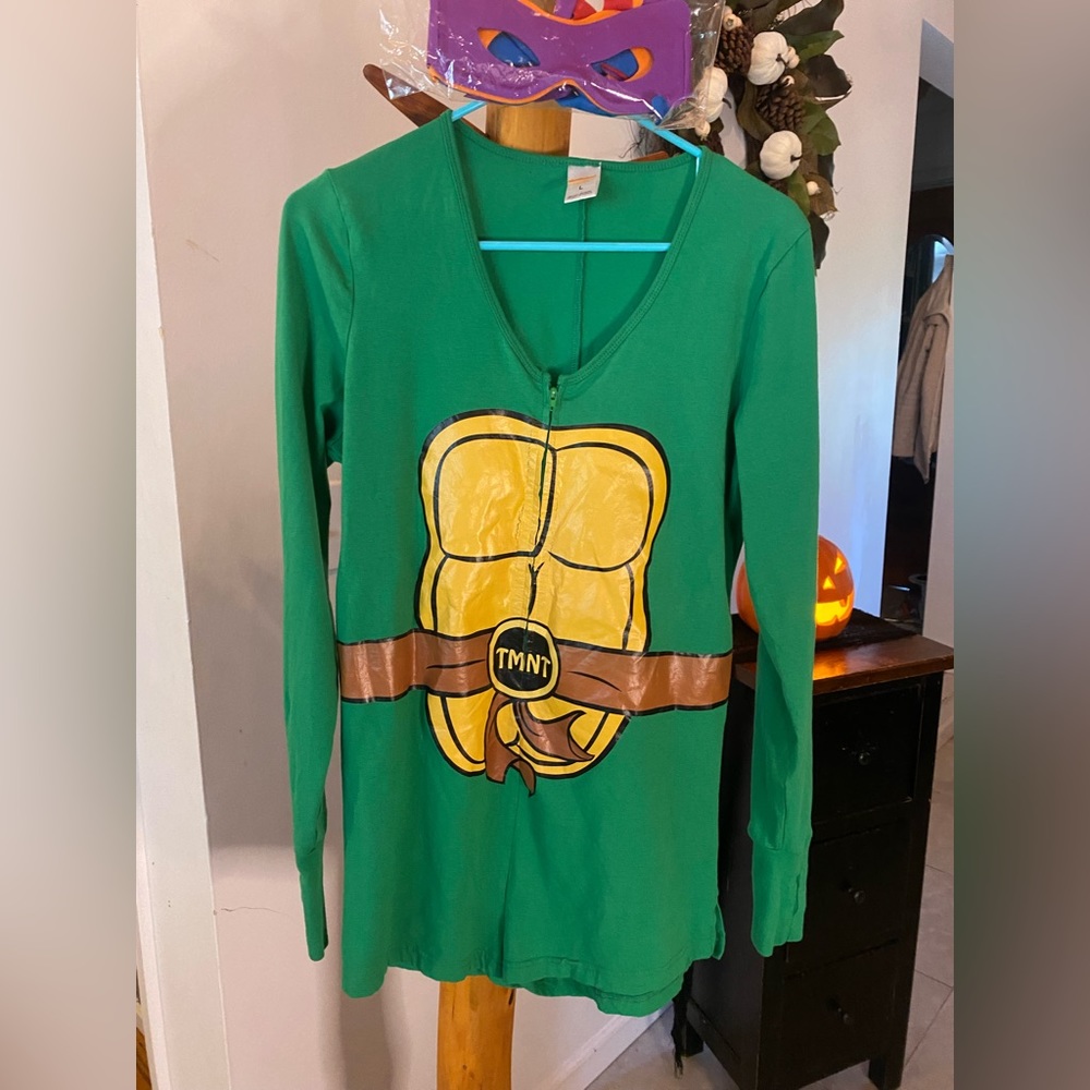 Woman’s size Large, ninja turtle shorts zip up jumpsuit, with unopened masks